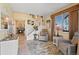 Open foyer showcases stairs, tile flooring, lots of natural light, and a glimpse of the living area with fireplace at 10041 Dillon Cir, Commerce City, CO 80022