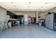 Spacious garage with epoxy floors, storage cabinets, and plenty of room for vehicles and projects at 10041 Dillon Cir, Commerce City, CO 80022