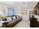 Comfortable living room with plush seating, warm lighting, and neutral decor, perfect for relaxation at 10041 Dillon Cir, Commerce City, CO 80022