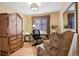 Home office featuring classic furniture, a comfortable armchair, and bright natural light at 10041 Dillon Cir, Commerce City, CO 80022