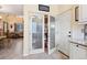 View of the walk-in pantry with plenty of storage space and glass doors at 10041 Dillon Cir, Commerce City, CO 80022