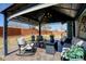 Outdoor patio featuring a stylish gazebo with comfortable seating and views of the backyard at 10041 Dillon Cir, Commerce City, CO 80022