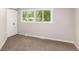 Clean bedroom featuring a large window and spacious closet at 1011 Yeager Dr, Longmont, CO 80501