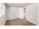 Bright bedroom with neutral walls, neutral carpet, and a spacious closet at 1011 Yeager Dr, Longmont, CO 80501