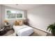 Cozy bedroom featuring a plush bed, decorative pillows, and a bright window at 1011 Yeager Dr, Longmont, CO 80501