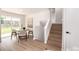 Bright and airy dining area featuring an outdoor view and easy access to the wooden stairs at 1011 Yeager Dr, Longmont, CO 80501