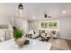 Bright and airy living room with views of the entry, stairs to the second floor, and the front yard at 1011 Yeager Dr, Longmont, CO 80501