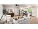Bright, open-concept living space with modern furnishings, a cozy seating area, and an updated kitchen at 1011 Yeager Dr, Longmont, CO 80501