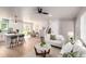 Inviting living area flowing into the kitchen, featuring hardwood floors, neutral tones, and modern decor at 1011 Yeager Dr, Longmont, CO 80501