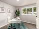 Stylish office showcasing a modern desk, carpet, and plenty of natural light at 1011 Yeager Dr, Longmont, CO 80501