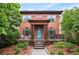Charming two-story home with a well-manicured front yard and a welcoming porch with seating at 8728 E 25Th Dr, Denver, CO 80238