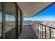 Enclosed balcony offering panoramic city views, glass doors, and metal railings at 1551 Larimer St # 2704, Denver, CO 80202