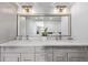 Bright bathroom featuring a double sink vanity with quartz countertops and modern lighting fixtures at 1551 Larimer St # 2704, Denver, CO 80202