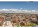 Sweeping city view showcasing the urban landscape with mixed-use buildings and distant mountains at 1551 Larimer St # 2704, Denver, CO 80202