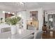 Dining area with modern lighting, view into the kitchen and decor at 1551 Larimer St # 2704, Denver, CO 80202