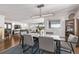 This dining room features modern lighting, neutral decor, and an open floor plan to the living room at 1551 Larimer St # 2704, Denver, CO 80202