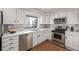 Modern kitchen with stainless steel appliances, sleek countertops and city views at 1551 Larimer St # 2704, Denver, CO 80202