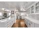 Bright, modern kitchen featuring white cabinetry, stainless steel appliances, and hardwood floors at 1551 Larimer St # 2704, Denver, CO 80202