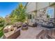 Back patio features a circular seating area around a stone fire pit at 22227 E Hinsdale Ave, Aurora, CO 80016