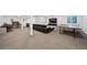 Spacious basement with living area, office, and game area with ping pong table at 22227 E Hinsdale Ave, Aurora, CO 80016