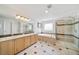 Large bathroom with double sinks, tub, and separate glass-enclosed shower at 22227 E Hinsdale Ave, Aurora, CO 80016