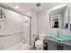 Modern bathroom with glass shower door and unique vanity at 22227 E Hinsdale Ave, Aurora, CO 80016