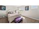Bedroom features neutral carpet, large window, light colored walls, and trunk at 22227 E Hinsdale Ave, Aurora, CO 80016