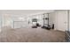 Upstairs bonus room with fitness area and neutral carpet at 22227 E Hinsdale Ave, Aurora, CO 80016