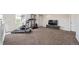 Loft area with gym equipment and lounge area at 22227 E Hinsdale Ave, Aurora, CO 80016