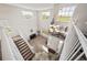 High ceiling entry foyer with grand chandelier and staircase at 22227 E Hinsdale Ave, Aurora, CO 80016