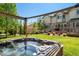 Backyard hot tub area, showing landscaping and outdoor entertaining space at 22227 E Hinsdale Ave, Aurora, CO 80016