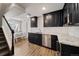 Modern basement kitchen features granite countertops, stainless steel appliances, and stylish cabinetry at 22227 E Hinsdale Ave, Aurora, CO 80016