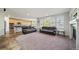 Open concept living space with natural light, seamlessly connecting to a kitchen with modern appliances at 22227 E Hinsdale Ave, Aurora, CO 80016