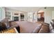 Spacious living room with a fireplace, built-in shelves, archways, and comfortable leather seating at 22227 E Hinsdale Ave, Aurora, CO 80016