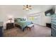 Main bedroom suite features a bay window, neutral carpet, and soft lighting at 22227 E Hinsdale Ave, Aurora, CO 80016