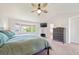 Spacious main bedroom with bay window, ceiling fan, and ensuite bathroom access at 22227 E Hinsdale Ave, Aurora, CO 80016