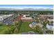 Gorgeous aerial view of townhomes, lush greenery, park and mountain views on the horizon at 7828 W 54Th Ave, Arvada, CO 80002