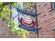 Exterior shot of Rhinelander Your German Bakery sign attached to a brick building at 7828 W 54Th Ave, Arvada, CO 80002
