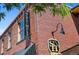 Corner shot of a brick building in Olde Town Arvada with School House Kitchen and Libations signs at 7828 W 54Th Ave, Arvada, CO 80002
