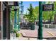 Olde Town Arvada main street with mature trees, street lamps, and sidewalk seating at 7828 W 54Th Ave, Arvada, CO 80002