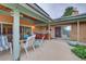 Relaxing covered back patio with a ceiling fan, outdoor furniture, and a hot tub at 8300 W 67Th Ave, Arvada, CO 80004