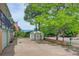 Backyard view of detached shed and brick walls along the driveway at 8300 W 67Th Ave, Arvada, CO 80004