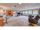 Spacious basement includes a rec room and a separate seating area with a fireplace at 8300 W 67Th Ave, Arvada, CO 80004