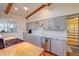 Bright kitchen features an island with gas range, stainless steel dishwasher, and hardwood floors at 8300 W 67Th Ave, Arvada, CO 80004
