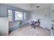 Cozy home office features natural light from a large window, enhancing the workspace at 8300 W 67Th Ave, Arvada, CO 80004
