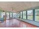 Inviting sunroom boasts many windows and tile floors at 8300 W 67Th Ave, Arvada, CO 80004