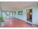 Inviting sunroom boasts many windows and tile floors at 8300 W 67Th Ave, Arvada, CO 80004