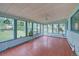 Inviting sunroom boasts many windows and tile floors at 8300 W 67Th Ave, Arvada, CO 80004