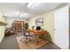 Finished basement with office space, desk, and bookshelves at 4198 E 117Th Ave, Thornton, CO 80233