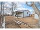 Side view of ranch home with covered patio at 4198 E 117Th Ave, Thornton, CO 80233